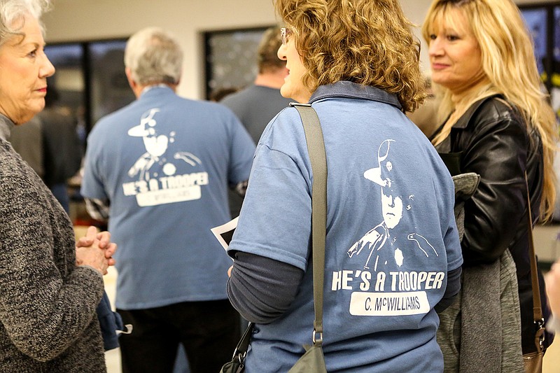 Members of the community wear shirts with the face of Cpl. Clayton McWilliams to support him and his family at a fundraiser to help pay his medical bills on Jan. 12 at Ashdown, Ark., High School. The event raised $55,000.
