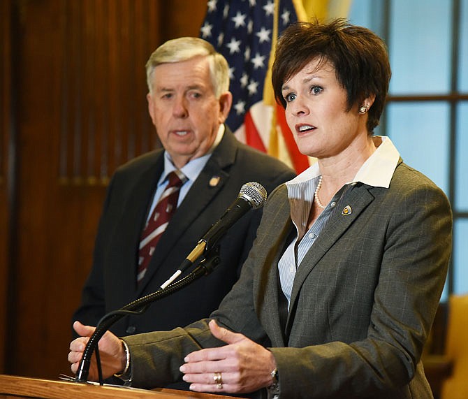 JANUARY 2019 FILE: Missouri Department of Corrections Director Anne Precythe talks to reporters during press conference Friday with Gov. Mike Parson, background, to explain the plan to consolidate Crossroads Correctional and Western Missouri Correctional centers in Cameron. 