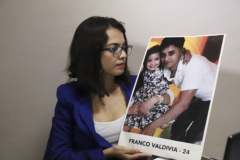 In this Jan. 8, 2019 photo, 28-year-old lawyer Francys Valdivia Machado, president of the Madres de Abril Association, holds a picture of her 24-year-old brother Franco who was killed during an April 2018 protest against social security cuts in Esteli, Nicaragua, during an interview with Associated Press journalists in an undisclosed location in Mexico where she is in hiding. She believes he was both shot by a sniper firing from City Hall. Fifteen minutes before Valdivia was shot, he had denounced authorities' use of force against peaceful protesters on a video on Facebook holding what appeared to be a rubber bullet in his hand. (AP Photo)