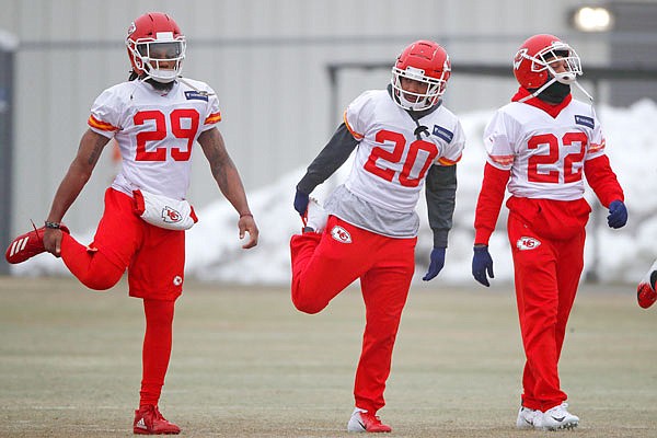 Chiefs defensive backs Eric Berry (29), Steven Nelson (20) and Orlando Scandrick (22) stretch during workouts Friday in Kansas City.