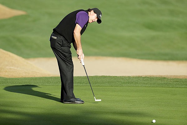 Phil Mickelson watches his putt on the 10th hole during Friday's second round of the Desert Classic on the Nicklaus Tournament Course at PGA West in La Quinta, Calif.