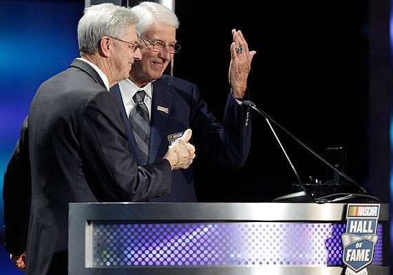 In this Jan. 20, 2012, file photo, Glen Wood (right) shows off his induction ring as his brother, Leonard Wood, looks on during the NASCAR Hall of Fame induction ceremony at the NASCAR Hall of Fame in Charlotte, N.C.
