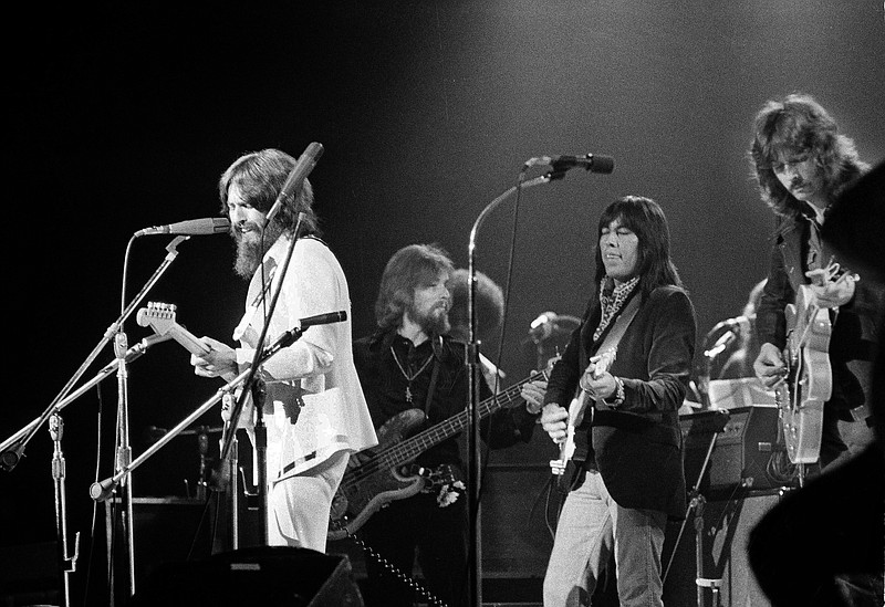 FILE - In this Aug. 1, 1971 file photo, Jesse Ed Davis, center right, a guitarist of Kiowa and Comanche ancestry, performs with George Harrison, left, formerly of the Beatles, at the Concert For Bangladesh at Madison Square Garden in New York City. Klaus Voorman is on bass, second from left, and Eric Clapton is at right. "RUMBLE: The Indians Who Rocked the World," a new PBS Independent Lens documentary set to air Monday, Jan 21, 2019, shows how Native Americans laid the foundations to rock, blues and jazz. (AP Photo/Jim Wells, File)