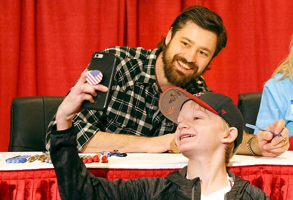 Dylan Howard, 13, of Phoenix, Ariz., snaps a selfie with relief pitcher Andrew Miller after getting his autograph Saturday at the Cardinals Care Winter Warm-Up in St. Louis.