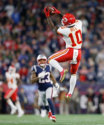 Chiefs wide receiver Tyreek Hill catches a pass he ran in for a touchdown during a regular-season game against the Patriots in Foxborough, Mass. The Chiefs and the Patriots will meet again today at Arrowhead Stadium for the AFC championship.