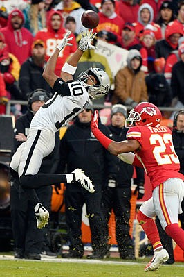 Chiefs cornerback Kendall Fuller defends as Raiders wide receiver Seth Roberts reaches for a pass during the regular-season finale last month at Arrowhead Stadium.