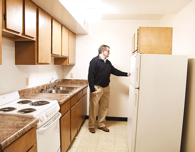 Jefferson City Housing Authority Commissioner Dennis Mueller checks out the newly-remodeled one bedroom apartment in Dulle Tower. Updating the rooms is an ongoing process in the Jefferson City high rise. 