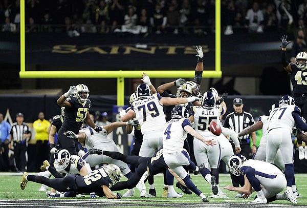 Rams kicker Greg Zuerlein kicks the game-winning field goal in overtime Sunday in the NFC championship game against the Saints in New Orleans.