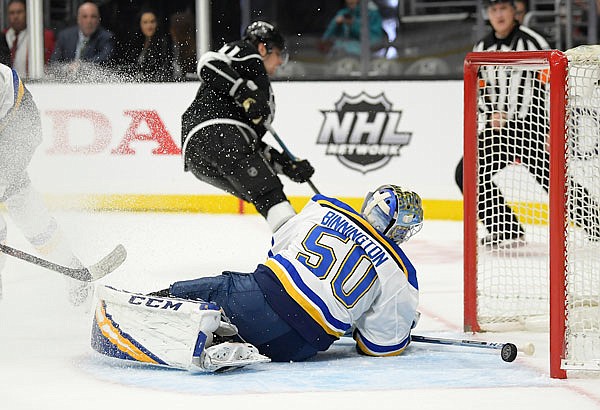 Blues goaltender Jordan Binnington is scored on by Kings center Anze Kopitar (background) during the second period of Monday's game in Los Angeles.