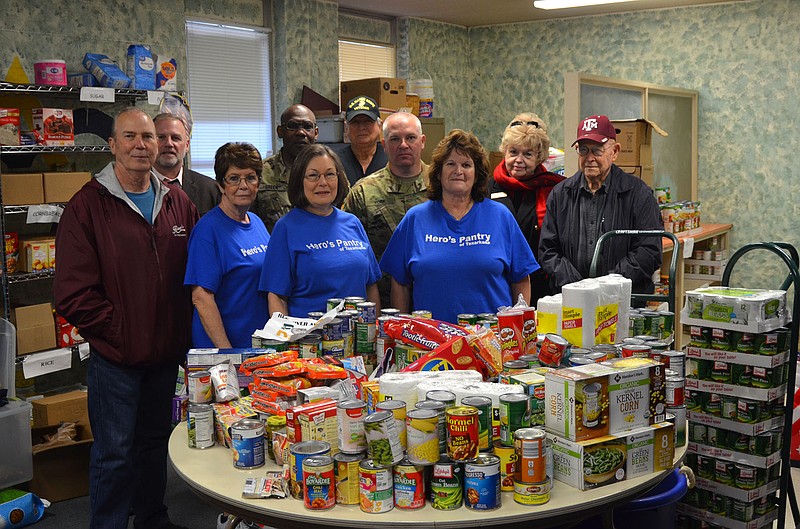 Red River Army Depot team leaders delivered more than 2.300 nonperishable food items to the Hero's Pantry of Texarkana in mid-January. The donations were made in connection with the depot's Toys for Tots campaign that runs from November to mid-December each year.
(Photo by Adrienne Brown)
