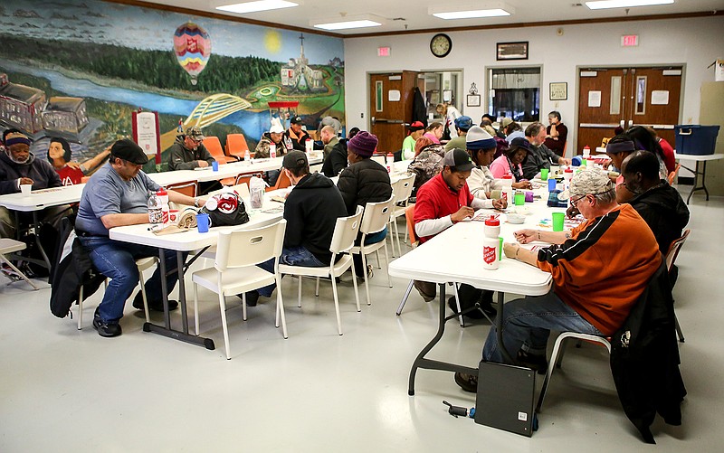 People play bingo after lunch at The Salvation Army Center of Hope on Tuesday in Texarkana, Ark. The Salvation Army is counting the number of homeless people on the Arkansas side for the Arkansas Point-in-Time Count.

