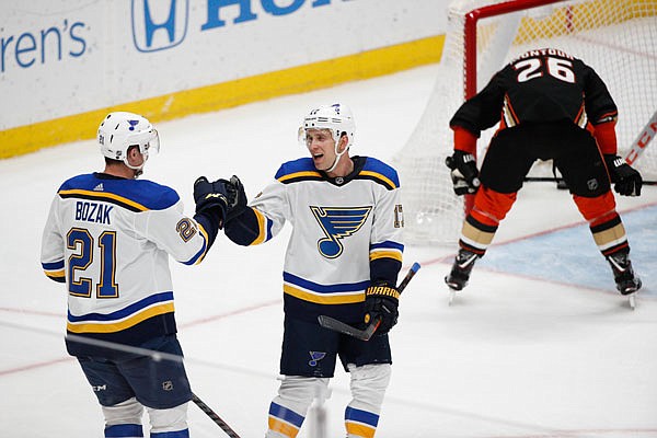 Tyler Bozak (left) celebrates his goal with Blues teammate Jaden Schwartz during the third period of Wednesday night's game against the Ducks in Anaheim, Calif.