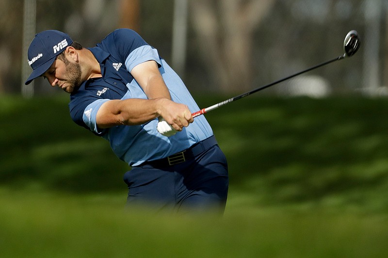 Jon Rahm, of Spain, hits from the fairway on the ninth hole during the first round of the Farmers Insurance Open golf tournament on the North Course at Torrey Pines Golf Course on Thursday, Jan. 24, 2019, in San Diego. (AP Photo/Chris Carlson)