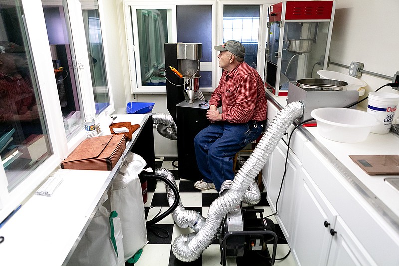 Wallace Elliott watches the Ethiopian coffee beans roast Wednesday to make sure they get to the right blend to sell at the Mission Texarkana