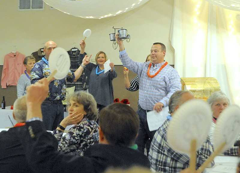 A piccadilly-style auction drew more than $3,000 in quarters and dollar bills to support the California Area Chamber of Commerce scholarship fund.