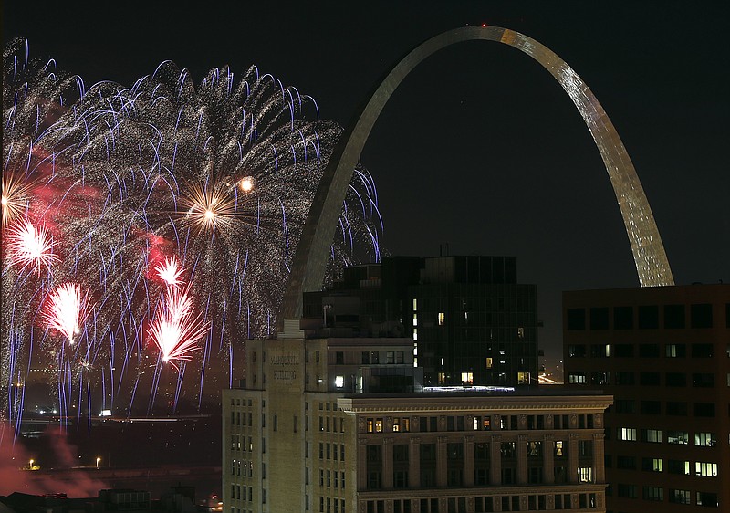 FILE - In this July 4, 2018 file photo, fireworks illuminate the night sky near the Gateway Arch in St. Louis. A task force called Better Together on Monday, Jan. 28, 2019, revealed a plan that calls for a statewide vote seeking approval to merge St. Louis city and county. If approved, the new "metropolitan city" would have 1.3 million residents, instantly becoming the nation's 10th largest city. St. Louis currently ranks 62nd in population with just under 309,000 residents. (AP Photo/Jeff Roberson, File)