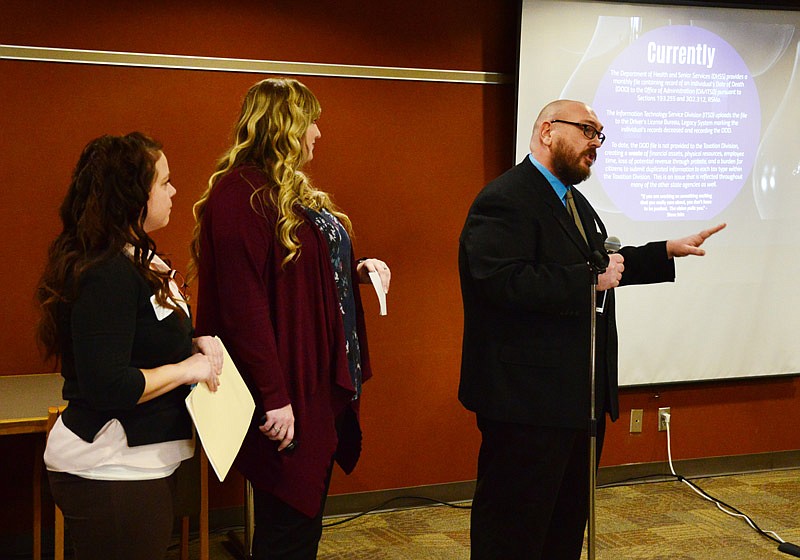 Heather Mosley, Danielle Porch and Robert Greenwood of the 'Statewide Mortality Data Exchange' team from the Department of Revenue give their presentation during the Show Me Challenge at the Harry S Truman State Office Building. Eleven teams presented their ideas for the judges Monday.