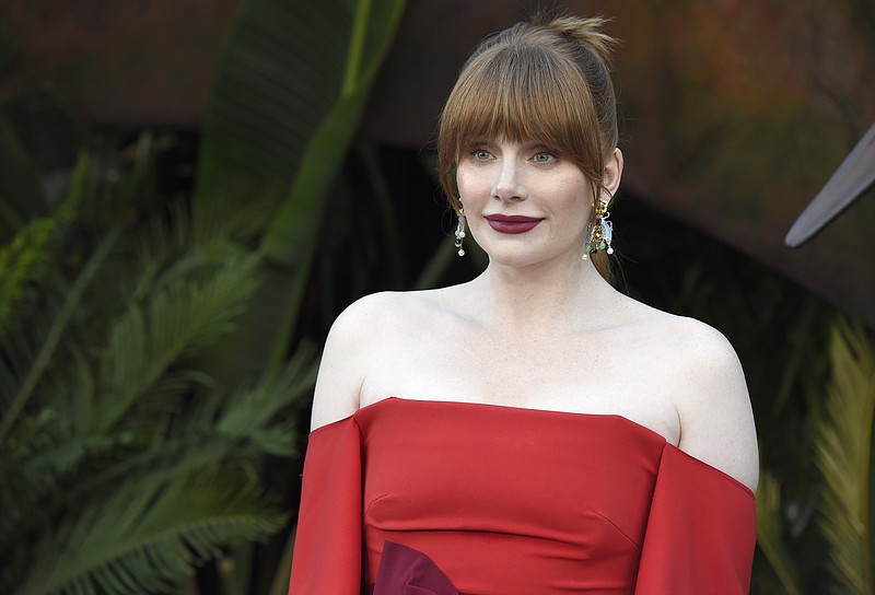 FILE -- In this Tuesday, June 12, 2018 file photo actor Bryce Dallas Howard arrives at the Los Angeles premiere of "Jurassic World: Fallen Kingdom" at the Walt Disney Concert Hall. Howard, an actor, producer and director, has been named 2019 Woman of the Year by Harvard University's Hasty Pudding Theatricals student group. (Photo by Chris Pizzello/Invision/AP, File)