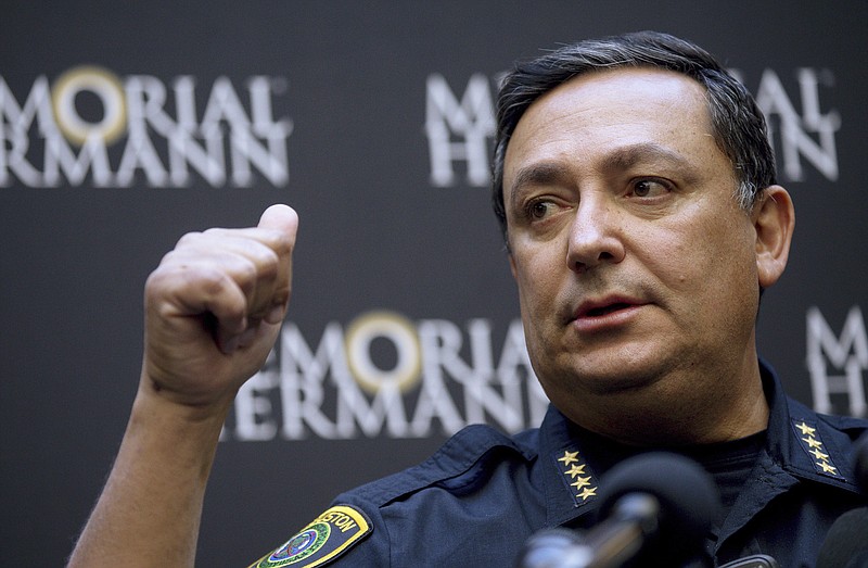 Houston Police Chief Art Acevedo talks to reporters during a news conference at Memorial Hermann Hospital on Tuesday, Jan. 29, 2019 in Houston. An attempt to serve a search warrant at a suspected drug house on Monday,  quickly turned into a gunbattle that killed two suspects and injured five undercover narcotics officers, including four who were shot, Acevedo said.  (Godofredo A. Vasquez/Houston Chronicle via AP)