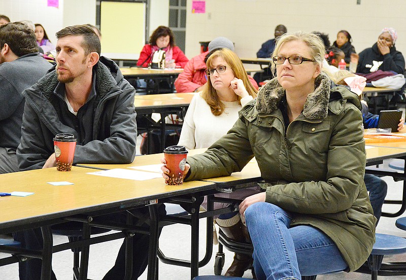 Attendees to a town hall meeting Tuesday at Lewis and Clark Middle School listen to Jason Hoffmann, chief financial officer/chief operating officer at Jefferson City Public Schools, and Superintendent Larry Linthacum discuss potential changes to school start times. Another town hall meeting will be at 5 p.m. Thursday at Thomas Jefferson Middle School.