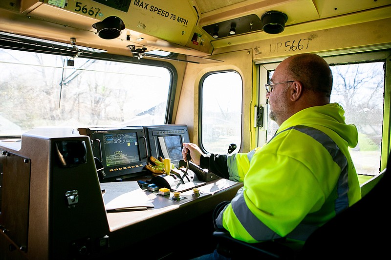 Conductor Bradley Burns drives the train toward the Kings Highway railroad crossing Tuesday for Bowie County Sheriff's Department to monitor for unsafe drivers and pedestrian behaviors in Texarkana, Texas.