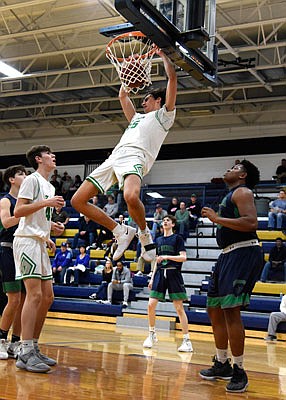 Eric Northweather of Blair Oaks dunks the ball during Saturday's game against St. Michael the Archangel in the Central Bank Shootout at Rackers Fieldhouse.