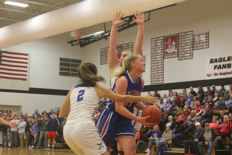 <p>Democrat photo/ Kevin Labotka</p><p>Paige Lamm tries to go through two defenders during California’s 45-30 loss to Boonville at the Southern Boone Classic championship game, Feb. 2.</p>