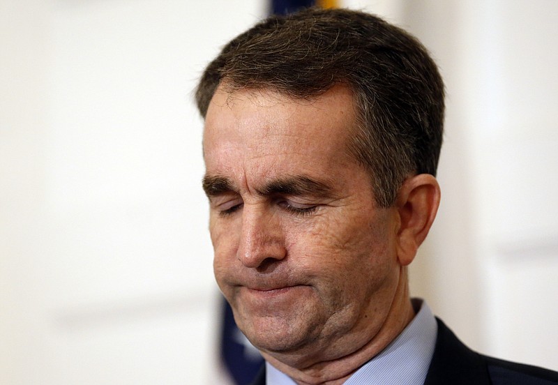 Virginia Gov. Ralph Northam pauses during a news conference in the Governor's Mansion in Richmond, Va., on Saturday, Feb. 2, 2019. Northam is under fire for a racial photo that appeared in his college yearbook. (AP Photo/Steve Helber)