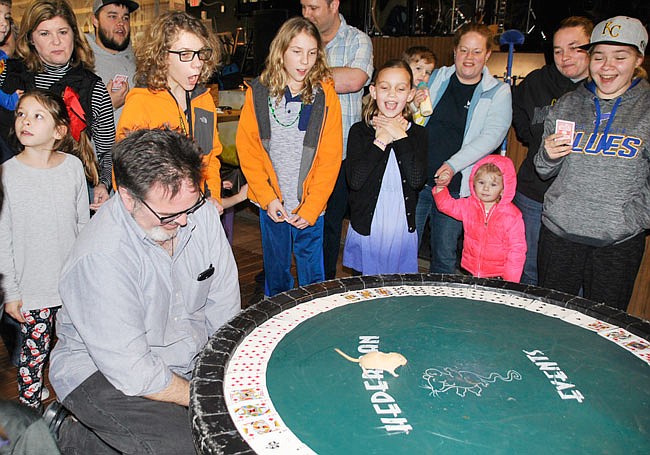 Onlookers cheer a mouse toward their chosen roulette card during a previous Callaway Cup Mouse Races event. In mouse roulette, event attendees buy in and bet on which card the mouse will select. The mouse is placed in the middle of the wheel, and a payout goes to whoever chose the card the mouse steps on first.