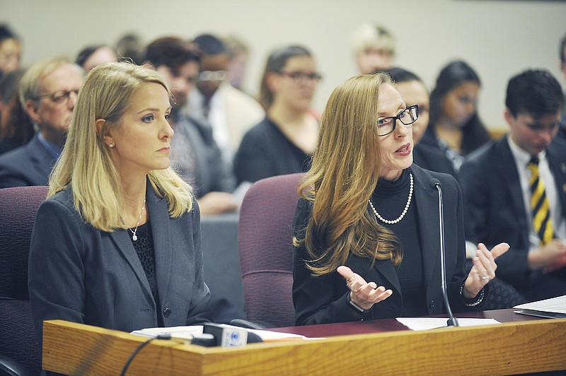 Representatives Tracy McCreery, D-St. Louis, left, and Holly Rehder, R-Sikseston, were seated before the House Health and Mental Health Policy Committee hearing Monday to discuss Missouri's criminal code concerning HIV. McCreery is sponsoring House Bill 166 while Rehder is sponsor of House Bill 167 to update Missouri's law regarding legal treatment of individuals with HIV. 