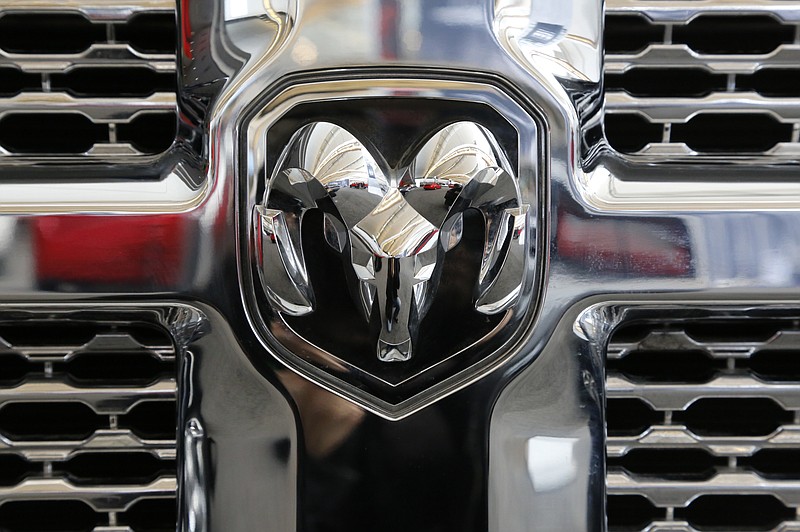 FILE- This Feb. 11, 2016, file photo shows the grill of a Ram 3500 Heavy Duty Turbo Diesel truck at the Pittsburgh International Auto Show in Pittsburgh. Fiat Chrysler is recalling over 660,000 heavy-duty trucks worldwide because a loose nut can cause a loss of steering control. The recall covers Ram 3500 pickups from 2013 through 2017, as well as 2500 pickups and 3500 Chassis cabs from 2014 through 2017. (AP Photo/Gene J. Puskar, File)