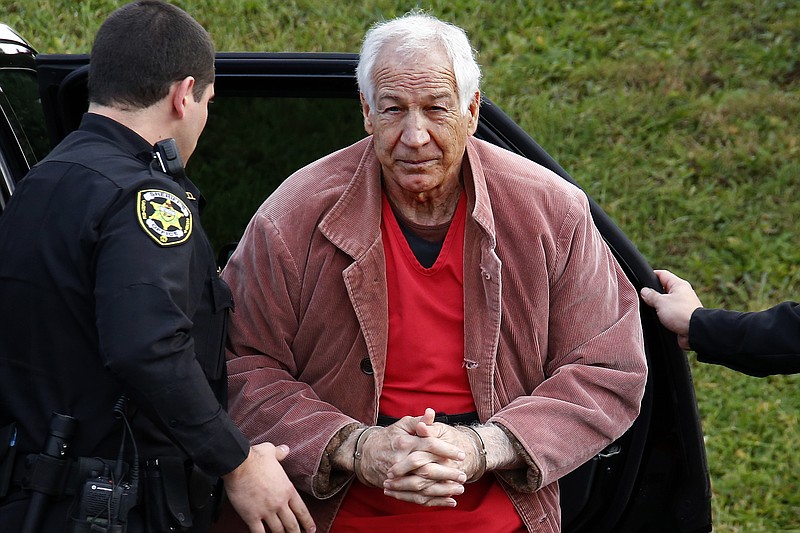 FILE - In this Oct. 29, 2015, file photo, former Penn State University assistant football coach Jerry Sandusky arrives for an appeal hearing at the Centre County Courthouse in Bellefonte, Pa. Sandusky lost a bid for a new trial Tuesday, Feb. 5, 2019, but a Pennsylvania appeals court ordered him to be re-sentenced for a 45-count child molestation conviction. Superior Court on Tuesday said Sandusky was improperly sentenced using mandatory minimums. The 75-year-old former Penn State assistant football coach was sentenced in 2012 to 30 to 60 years in state prison for sexual abuse of 10 boys. (AP Photo/Gene J. Puskar, File)