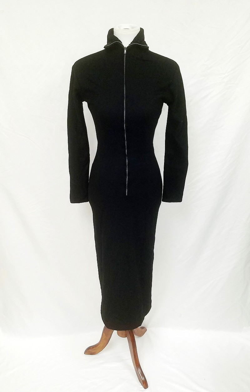 This undated image released by GWS Auctions shows a black dress that actress Marilyn Monroe wore to a 1954 press conference announcing her separation from baseball legend Joe DiMaggio. KruseGWS Auctions announced Wednesday that the simple wool dress with a zippered turtleneck front will be up for bidding starting on March 30. Monroe was wearing it in Beverly Hills on Oct. 6, 1954 when she stepped out amid a mob of cameras and reporters to announce the split in a marriage. (GWS Auctions via AP)