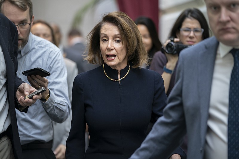 Speaker of the House Nancy Pelosi, D-Calif., walks with reporters to a Democratic Caucus meeting the morning after President Donald Trump's State of the Union speech, on Capitol Hill in Washington, Wednesday, Feb. 6, 2019. (AP Photo/J. Scott Applewhite)