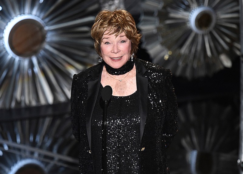 This Feb. 22, 2015, file photo shows Shirley MacLaine at the Oscars in Los Angeles. MacLaine was honored for career achievement by the AARP, the organization for retired persons and its AARP, The Magazine. The awards show will be broadcast Feb. 15, 2019, on PBS.  (Photo by John Shearer/Invision/AP, File)