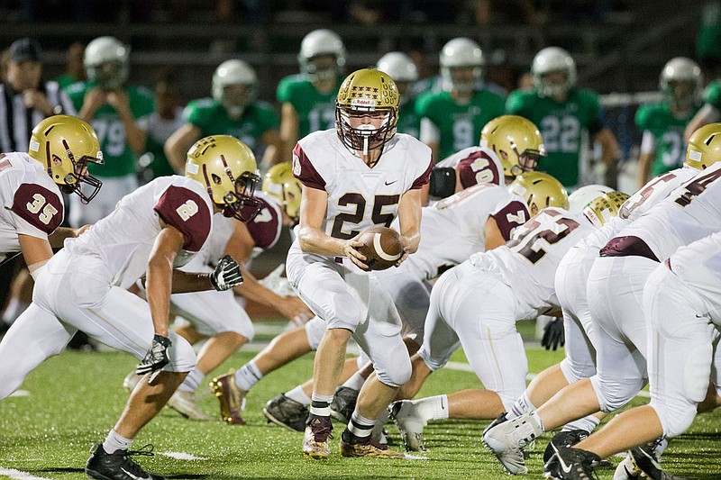 Dawson Brandt of the Eldon Mustangs prepares to hand off during a 2017 game against the Blair Oaks Falcons in Wardsville. Brandt signed a letter-of-intent Wednesday to play football at Lincoln.