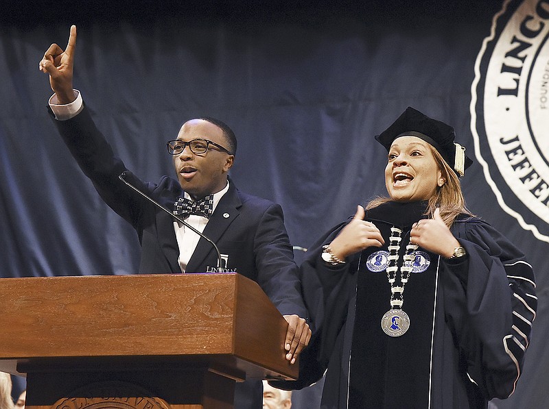 Kendall Montgomery, chair of the Campus Activity Board of Lincoln University, left, and President Jerald Jones Woolfolk participate in the LU Spirit chant that filled Richardson Fine Arts Center during Thursday's annual Founders Day Convocation.