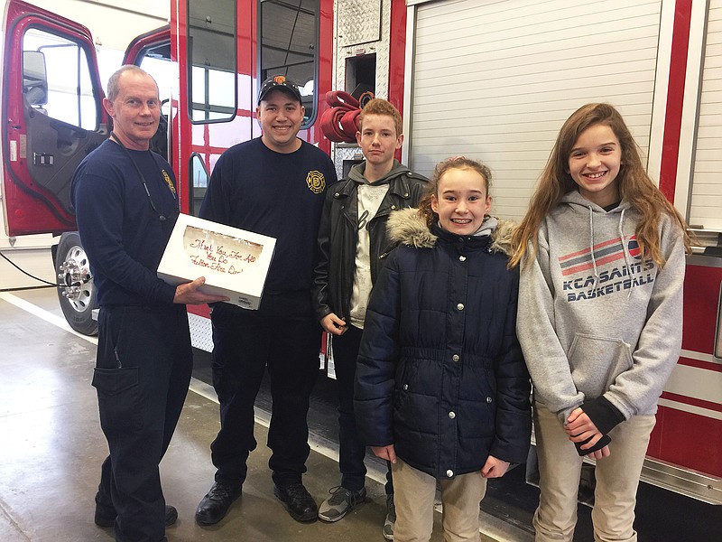 <p>Members of Kingdom Christian Academy’s student council including, from right, Teghan Sweeney, Maddie Hutchinson and Silas Barker (Allysun Phillippe not pictured) delivered cakes to the Fulton Fire Department, Callaway County Sheriff’s Office and Fulton Police Department. Once per month, students at KCA may pay $2 to wear jeans and a T-shirt to school. Student council collects the money and puts it toward a good cause.</p>
