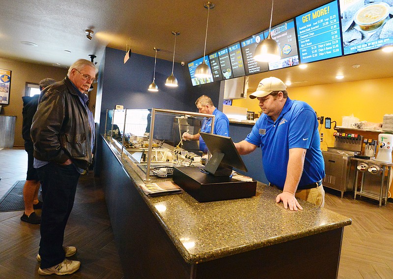 Mark Wilson/News Tribune
General Manager Craig Busby of BluTaco in Holts Summit tends to customers Thursday. The southwestern Mexican hot food brand by PFSbrands, opened its first standalone restaurant on Monday, Feb. 4. 