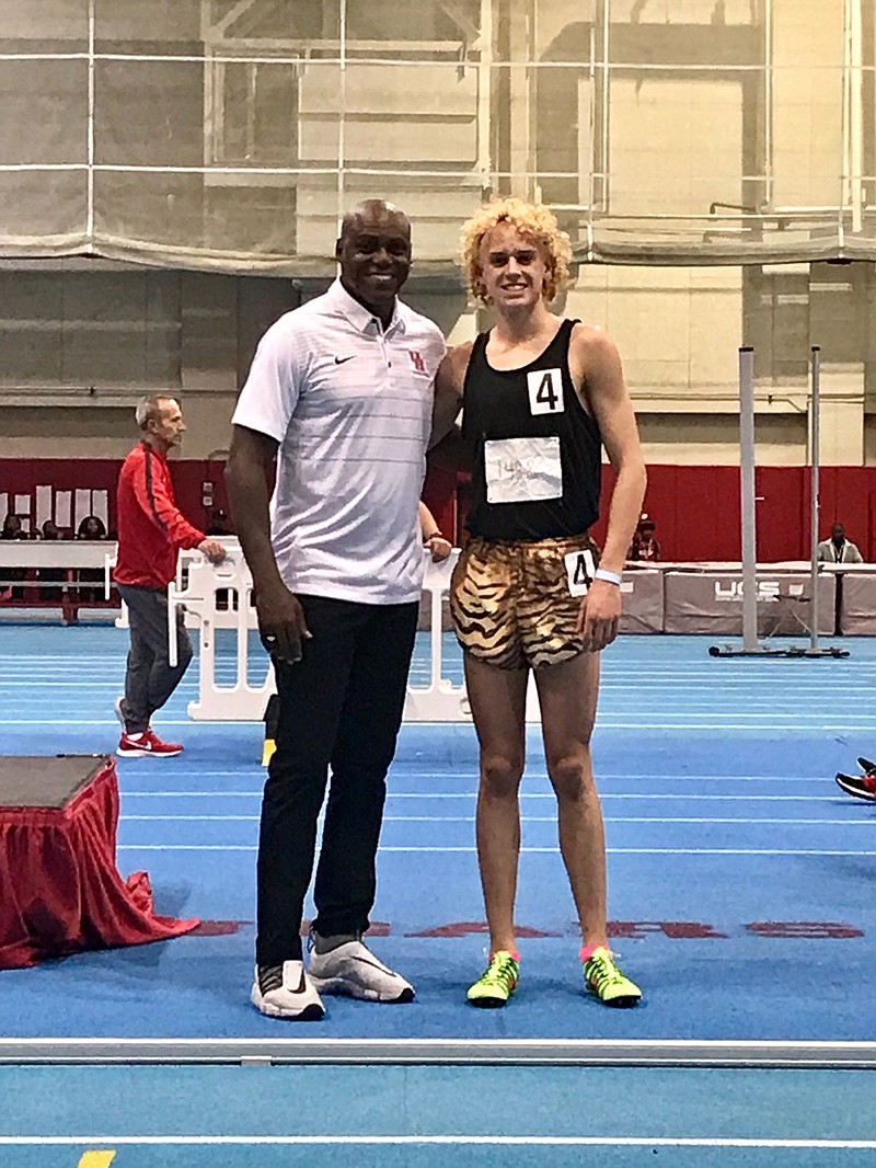 Owen Likins, right, a Texas High junior, poses with Olympic legend Carl Lewis at the Carl Lewis High School Invitational in January at the University of Houston. (Photo courtesy Susan Likins)
