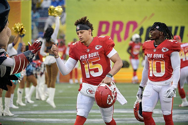 Chiefs teammates Patrick Mahomes (15) and wide receiver Tyreek Hill (10) run onto the field during introductions of the AFC team prior to last month's Pro Bowl in Orlando, Fla.