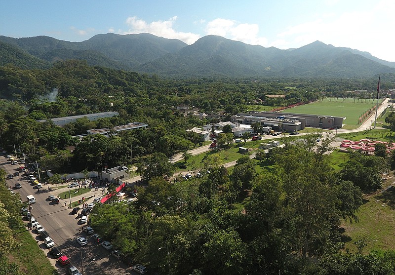 In aerial view shown over the Flamengo soccer club training complex where an early morning fire left a number of people dead in Rio de Janeiro, Brazil, Friday, Feb. 8, 2019. (AP Photo/Renato Spyrro)