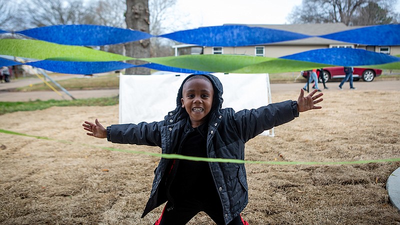 Ayden Blair celebrates the new home he and has family will move into Friday in Texarkana, Ark. Habitat for Humanity of Texarkana held a blessing and dedication for the first time on the Arkansas side for the Blair family home.