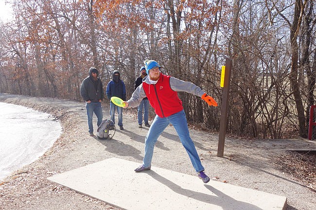 Christopher Hoffmann tees up a toss during the 2019 Ice Bowl on Saturday. The tournament, organized by the local disc golf community, raises money for charity.