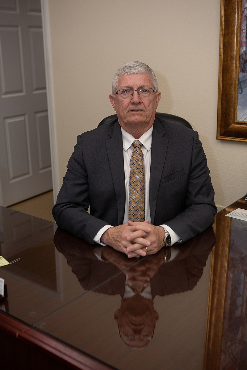 Eddie Hawkins poses for a portrait Wednesday at Texarkana Funeral Home in Texarkana, Ark. Hawkins will retire from the funeral home after 41 years.