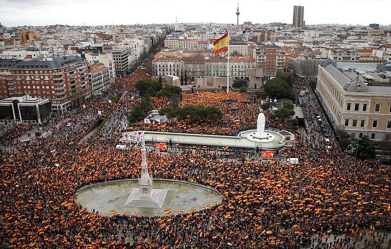 Thousands of demonstrators hold Spanish flags during a protest in Madrid, Spain, on Sunday, Feb.10, 2019. Thousands of Spaniards in Madrid are joining a rally called by right-wing political parties to demand that Socialist Prime Minister Pedro Sanchez step down. (AP Photo/Andrea Comas)