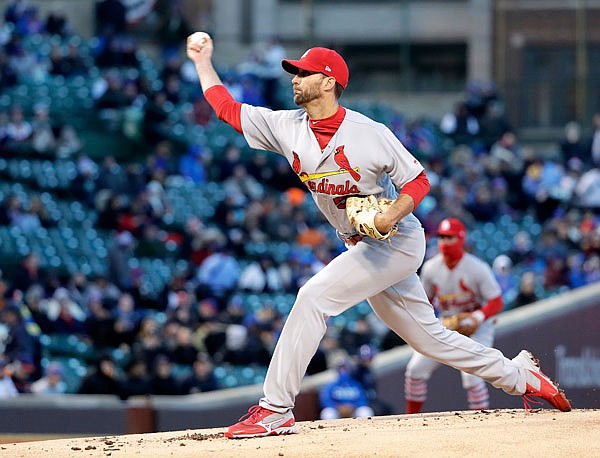 In this April 17, 2018, file photo, Cardinals starting pitcher Adam Wainwright delivers a pitch during the first inning of a game against the Cubs in Chicago.