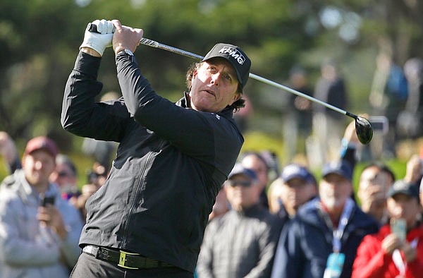 Phil Mickelson follows his drive from the fourth tee of the Pebble Beach Golf Links during Sunday's final round of the AT&T Pebble Beach Pro-Am in Pebble Beach, Calif.