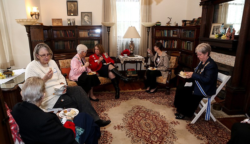 Daughters of the American Revolution and guests enjoy food and tea Sunday, Feb. 10, 2019, at the George Washington Tea Party at the P.J. Ahern Home in Texarkana, Ark.