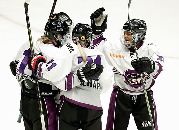 Team Szabados forward Audra Richards (21) is congratulated after scoring a goal against Team Stecklein in Sunday's NWHL All-Star Hockey Game in Nashville, Tenn.